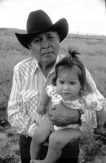 Native American man hoding grandaughter